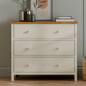 White chest of drawers in a room setting