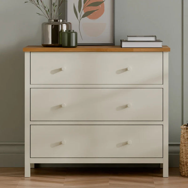 White chest of drawers in a room setting