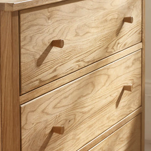 Wooden dresser with five drawers and wooden handles.