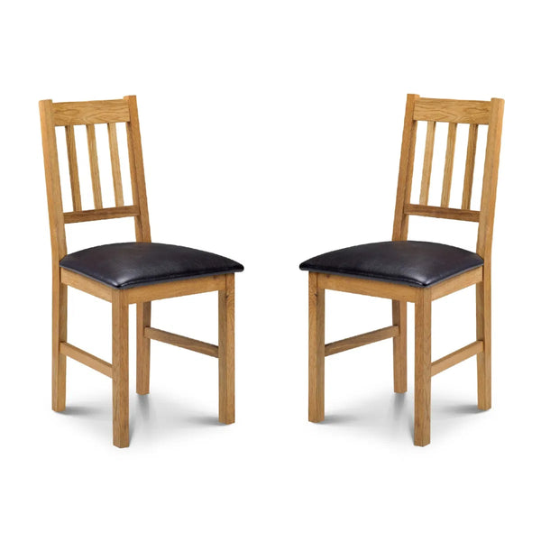 Two wooden chairs with black cushioned seats on a white background