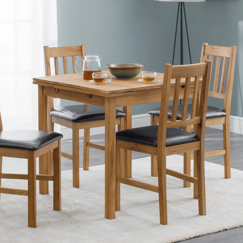 Wooden dining table on a white background