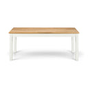 Rectangular table with wooden top and white legs on a white background
