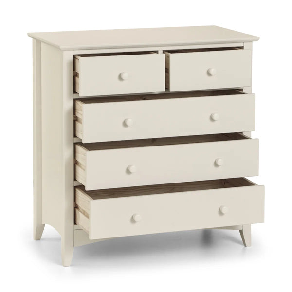 White dresser with multiple drawers on a white background
