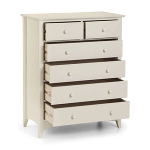 White dresser with multiple drawers on a white background