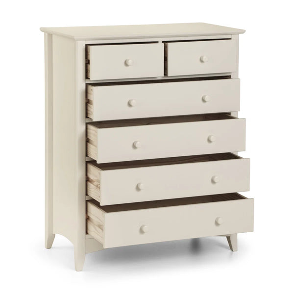 White dresser with multiple drawers on a white background