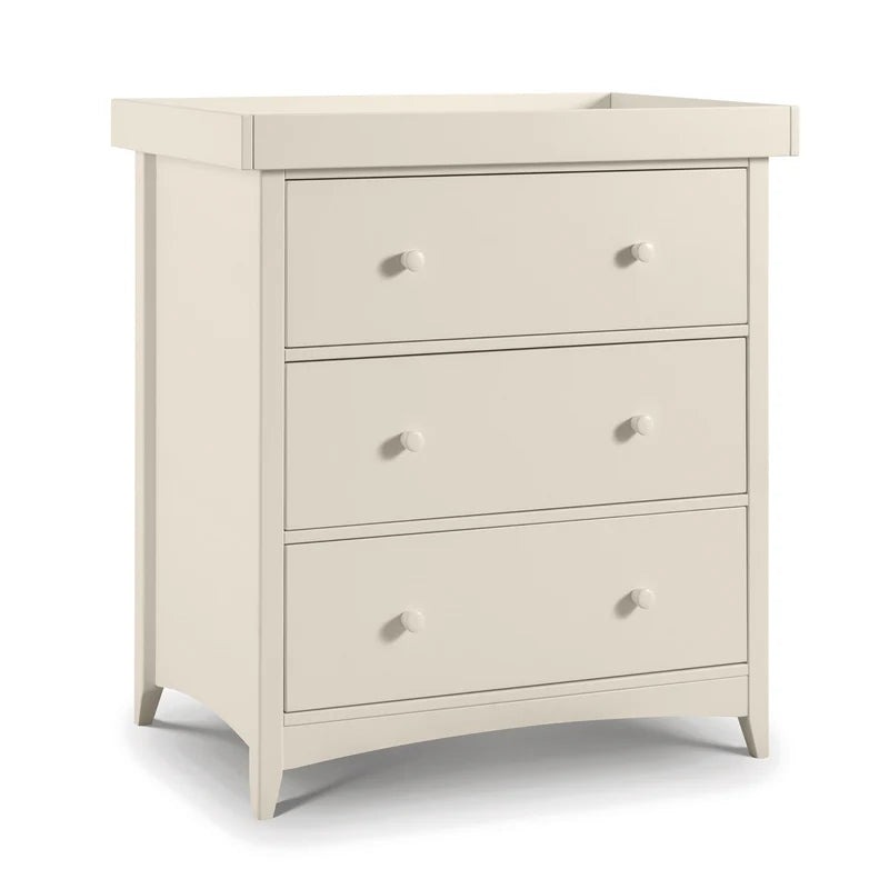White changing unit dresser with three drawers on a white background
