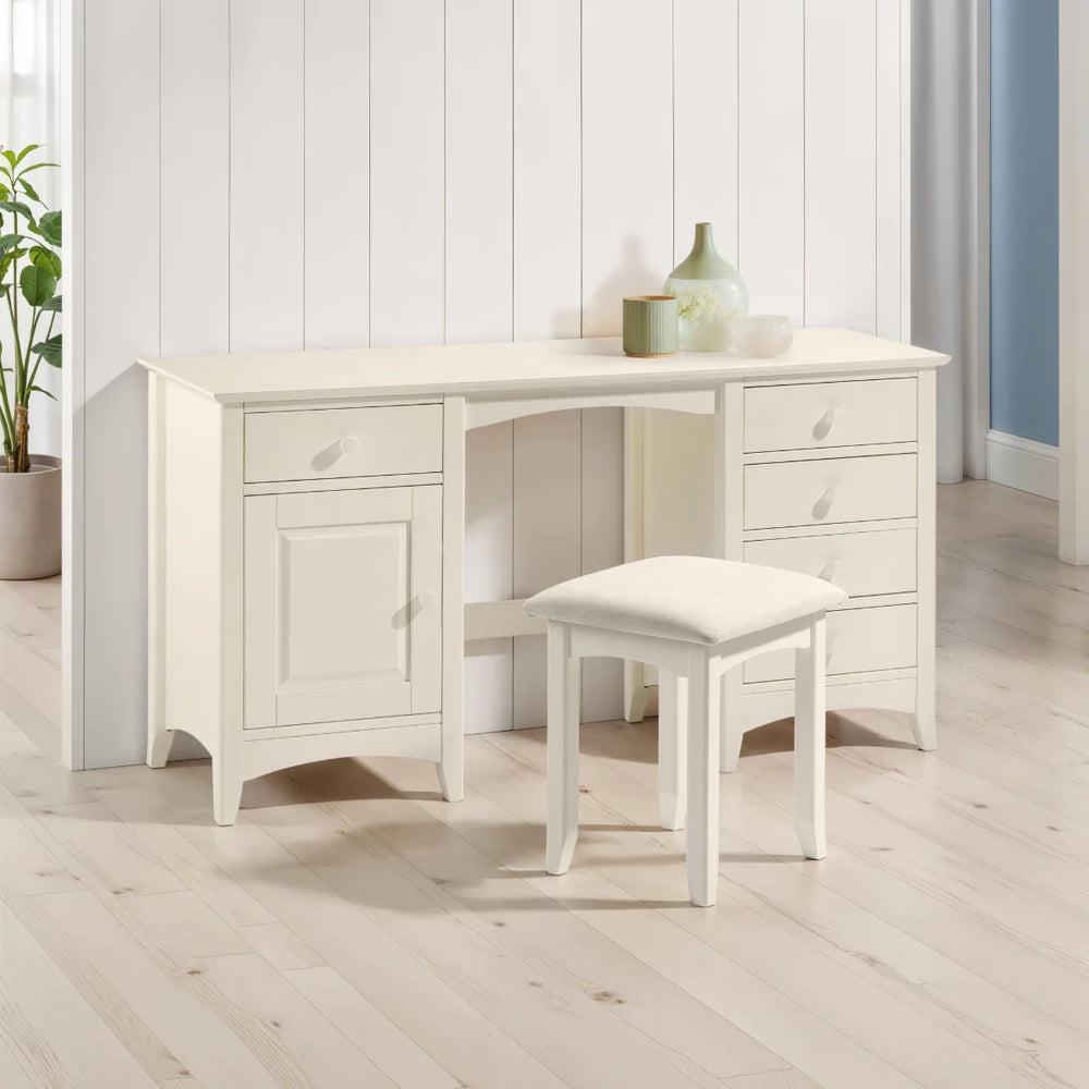White desk with a matching stool on a white background