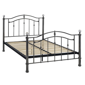 Black metal bed frame with decorative elements on a white background