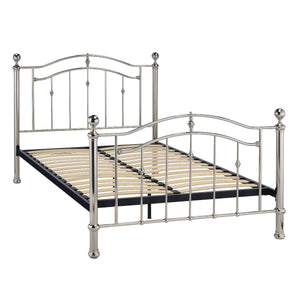 Metal bed frame with decorative posts on a white background