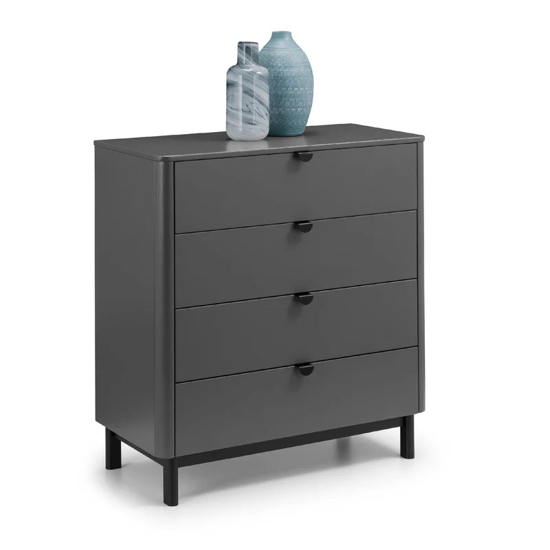 Gray dresser with four drawers and two decorative vases on top against a white background