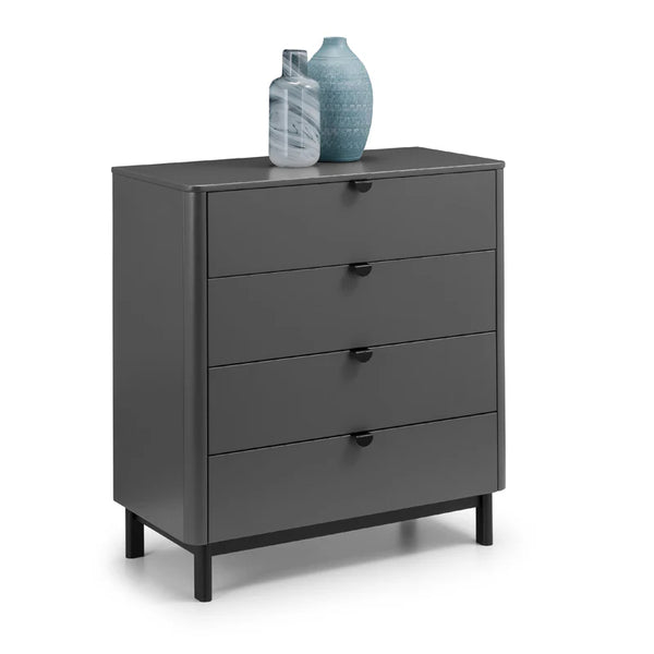 Gray dresser with four drawers and two decorative vases on top against a white background
