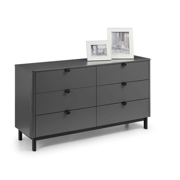 Gray dresser with six drawers on a white background