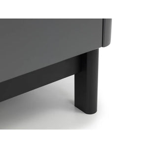 Close-up of a dark gray table with a black leg on a white background