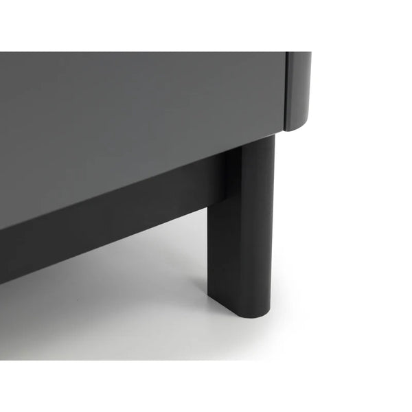 Close-up of a dark gray table with a black leg on a white background