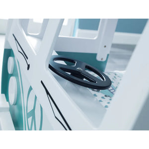 Close-up of a steering wheel on a boat with a blurred background