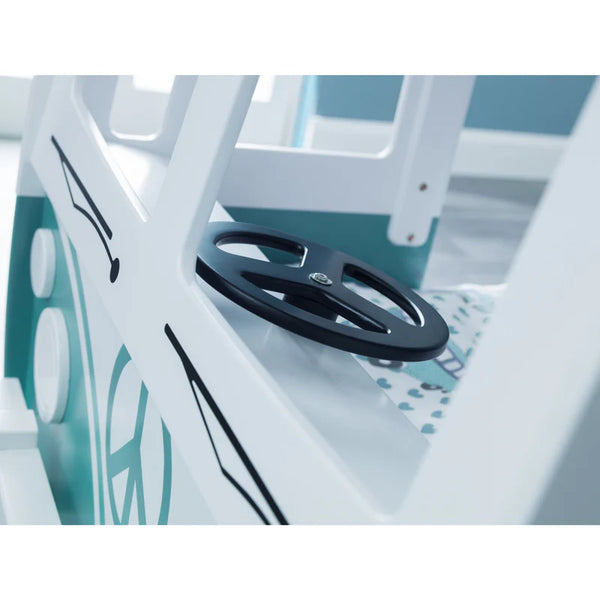 Close-up of a steering wheel on a boat with a blurred background