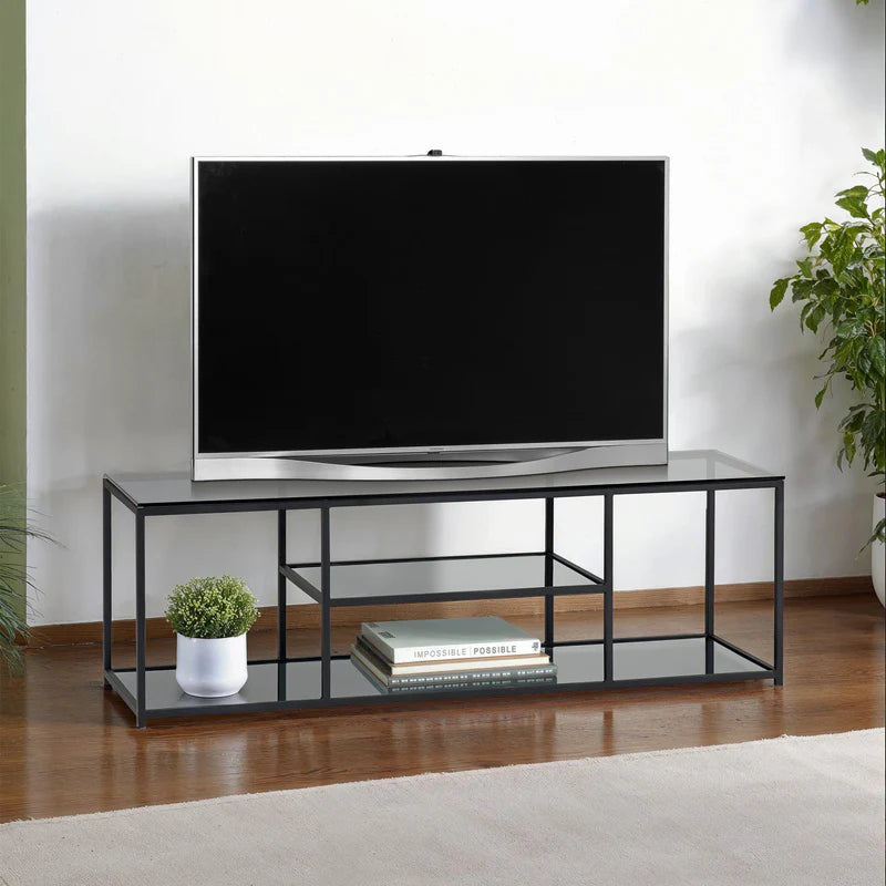 Black metal TV stand with glass shelves on a white background