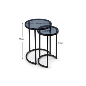 Set of two black nesting tables with measurements on a white background