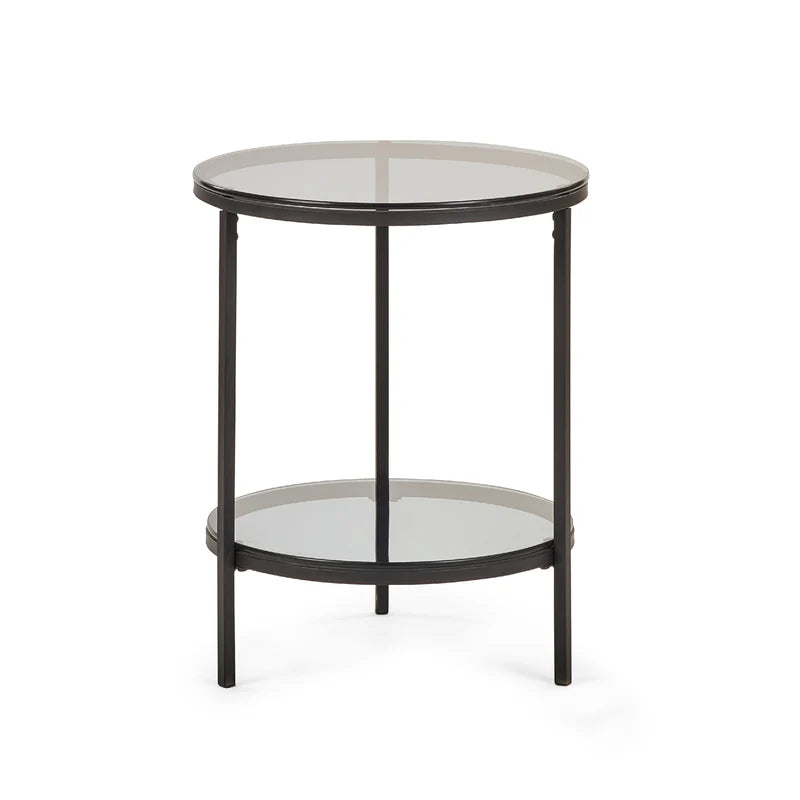 Round side table with glass top and black metal frame on a white background