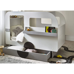 Children's bunk bed with toys and books on a carpeted floor