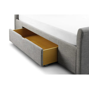 Gray upholstered bed with a gold drawer on a white background