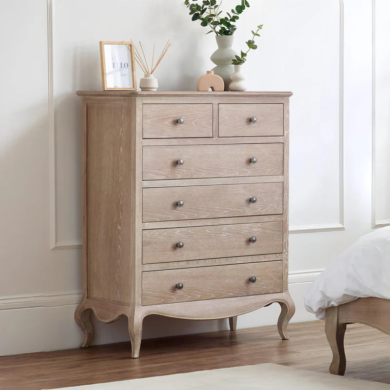 Wooden dresser with multiple drawers on a white background