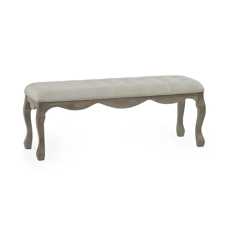 Decorative bench with tufted seat on a white background
