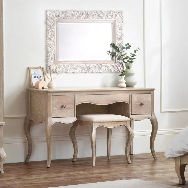 Wooden vanity table with two drawers and a matching stool on a white background