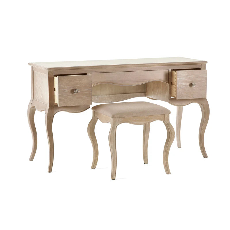 Wooden vanity table with two drawers and a matching stool on a white background
