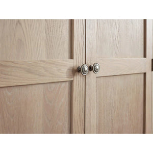 Wooden cabinet with two doors and metallic handles on a white background