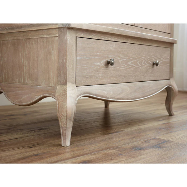 Wooden dresser with a single drawer on a wooden floor.