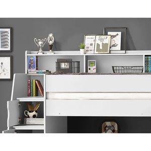 White bookshelf with decorative items against a gray wall