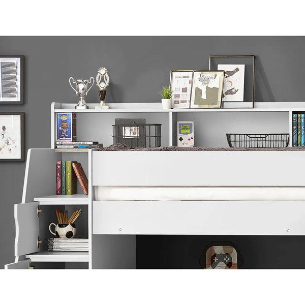 White bookshelf with decorative items against a gray wall
