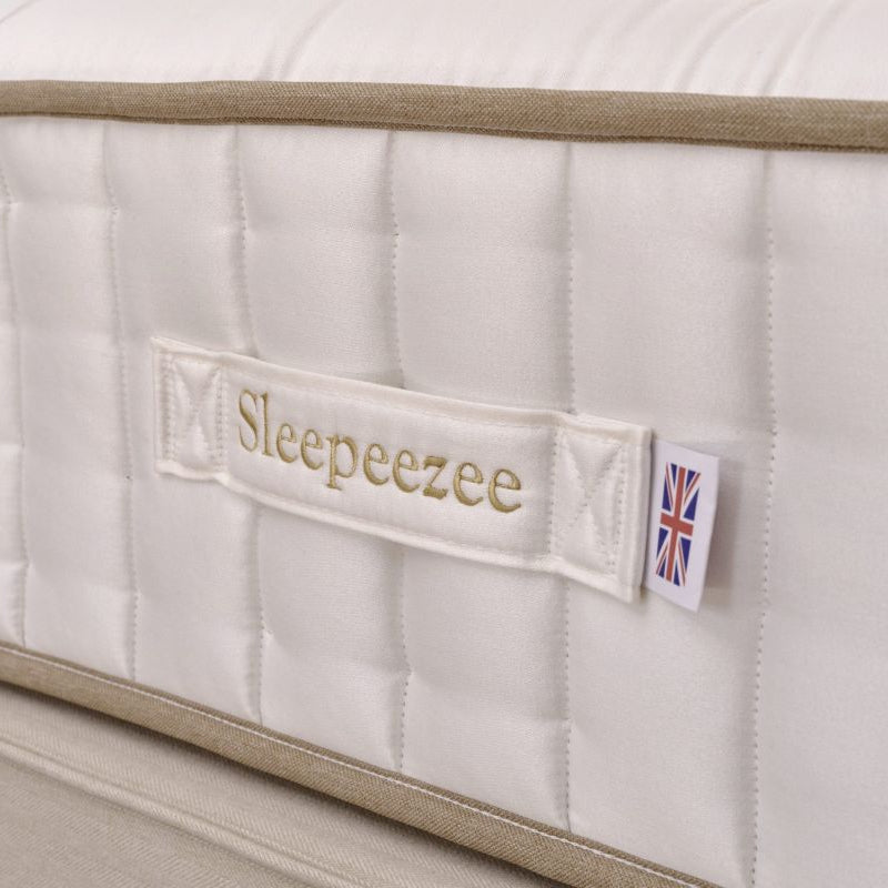 Close-up of a Sleepeezee mattress with a visible brand label.