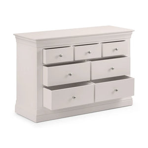 Grey dresser with multiple drawers on a white background