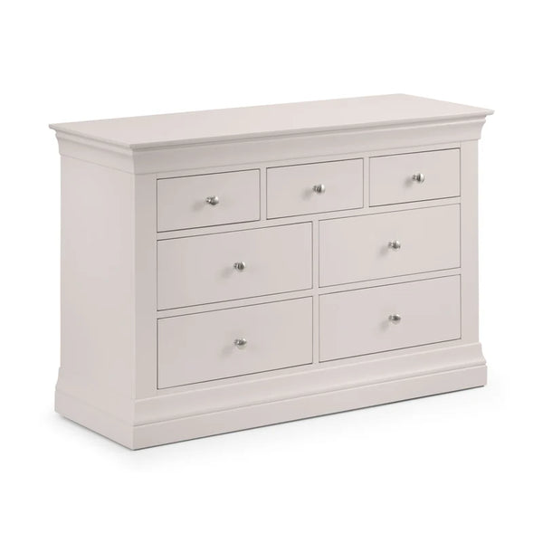 Grey dresser with multiple drawers on a white background