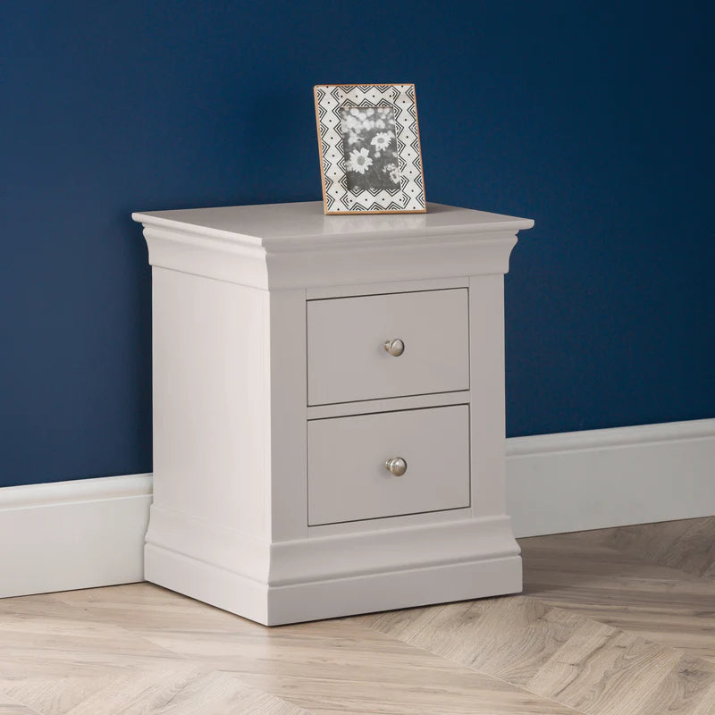 Light gray nightstand with two drawers on a white background