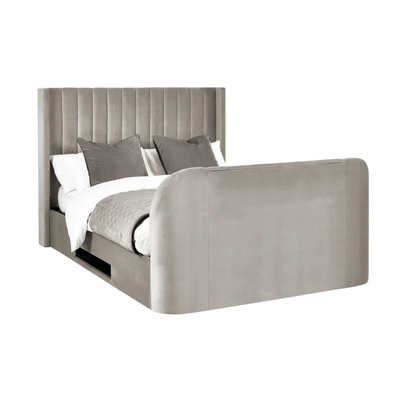 Gray upholstered bed with white bedding and gray pillows on a white background