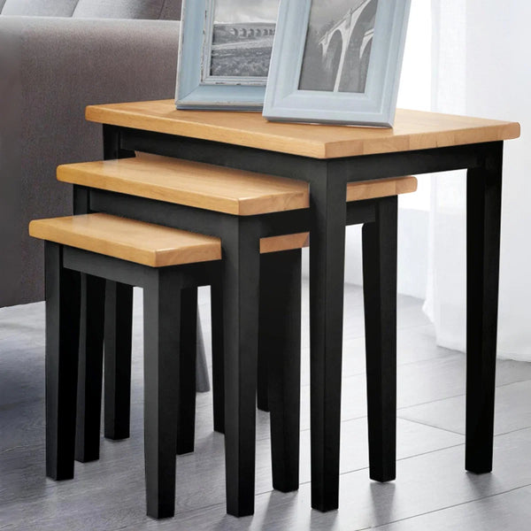 Coast nest of tables black and oak in roomshot
