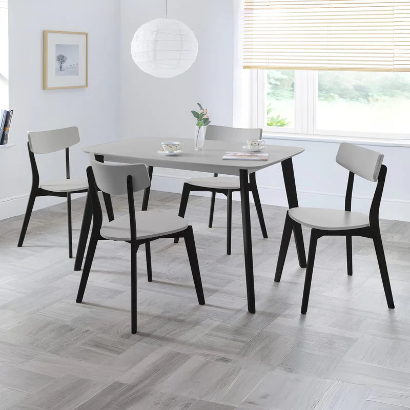 Square table with black legs on a white background