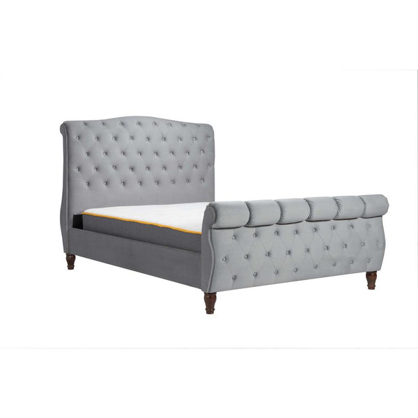 Gray upholstered bed with tufted design on a white background