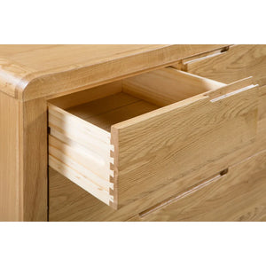 Wooden drawer of a piece of furniture on a white background