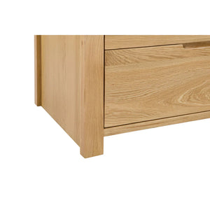 Wooden drawer unit with a single open drawer on a white background