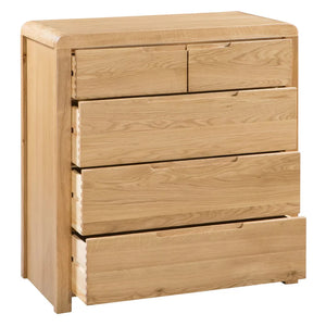 Wooden dresser with four drawers on a white background