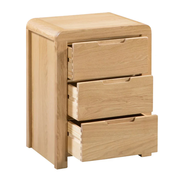 Wooden nightstand with three drawers on a white background