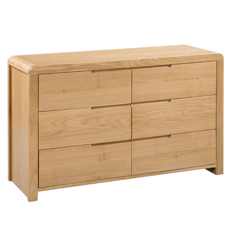 Wooden dresser with six drawers on a white background