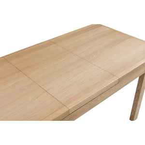 Wooden dining table with extendable design on a white background