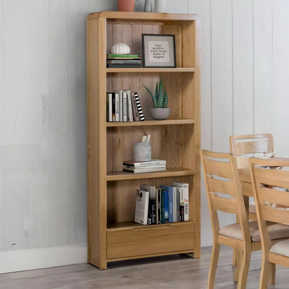 Wooden bookshelf with four shelves on a white background