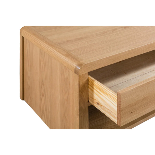 Wooden drawer unit with a partially open drawer on a white background