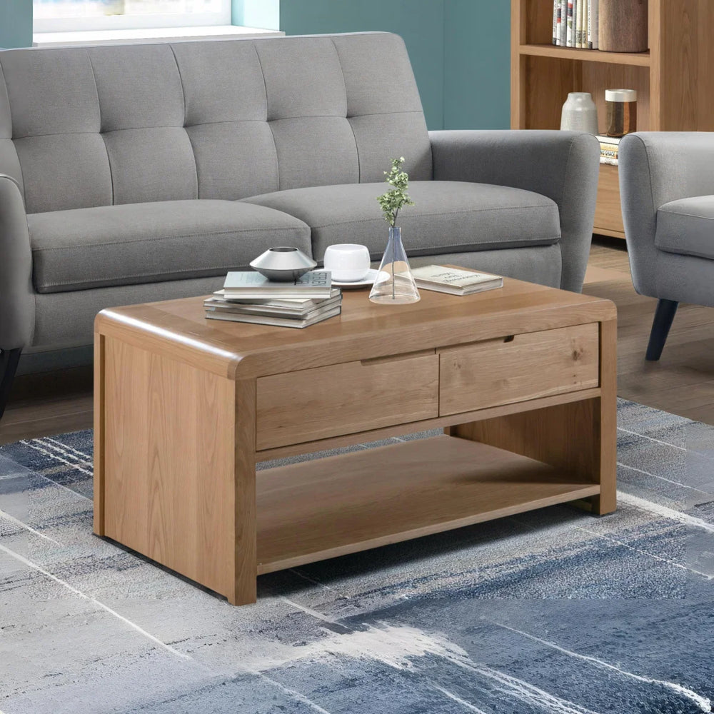 Wooden coffee table with two drawers on a white background